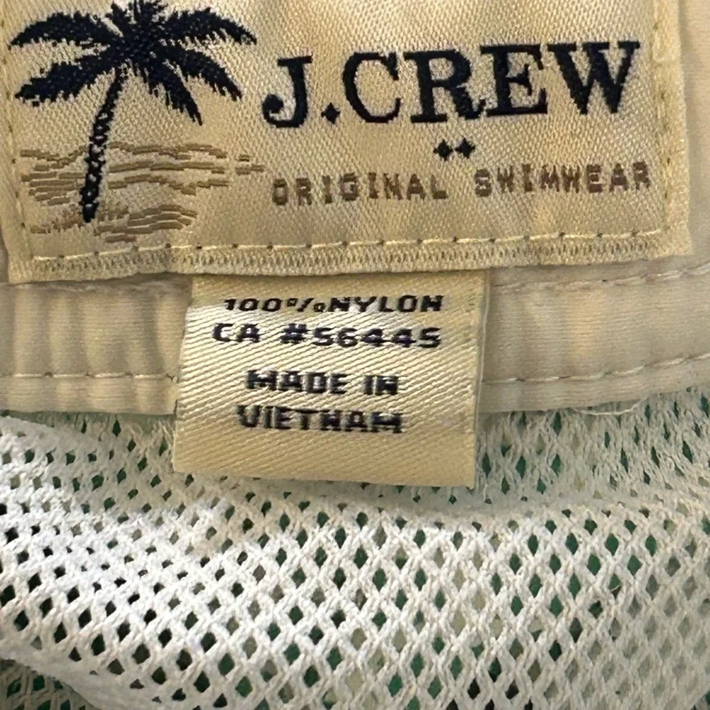 J.Crew Men's Swim Trunks in a green and white geometric print.